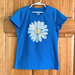 Girl’s size 10-12 Faded Glory short sleeved blue polka dot T-shirt with flower